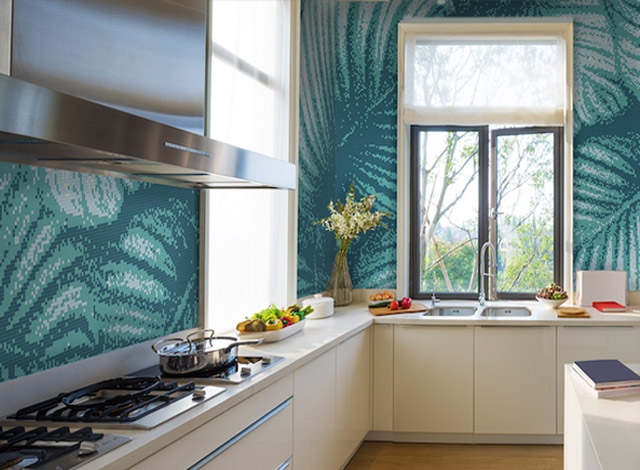 Kitchen with a teal leaf-pattern mosaic wall